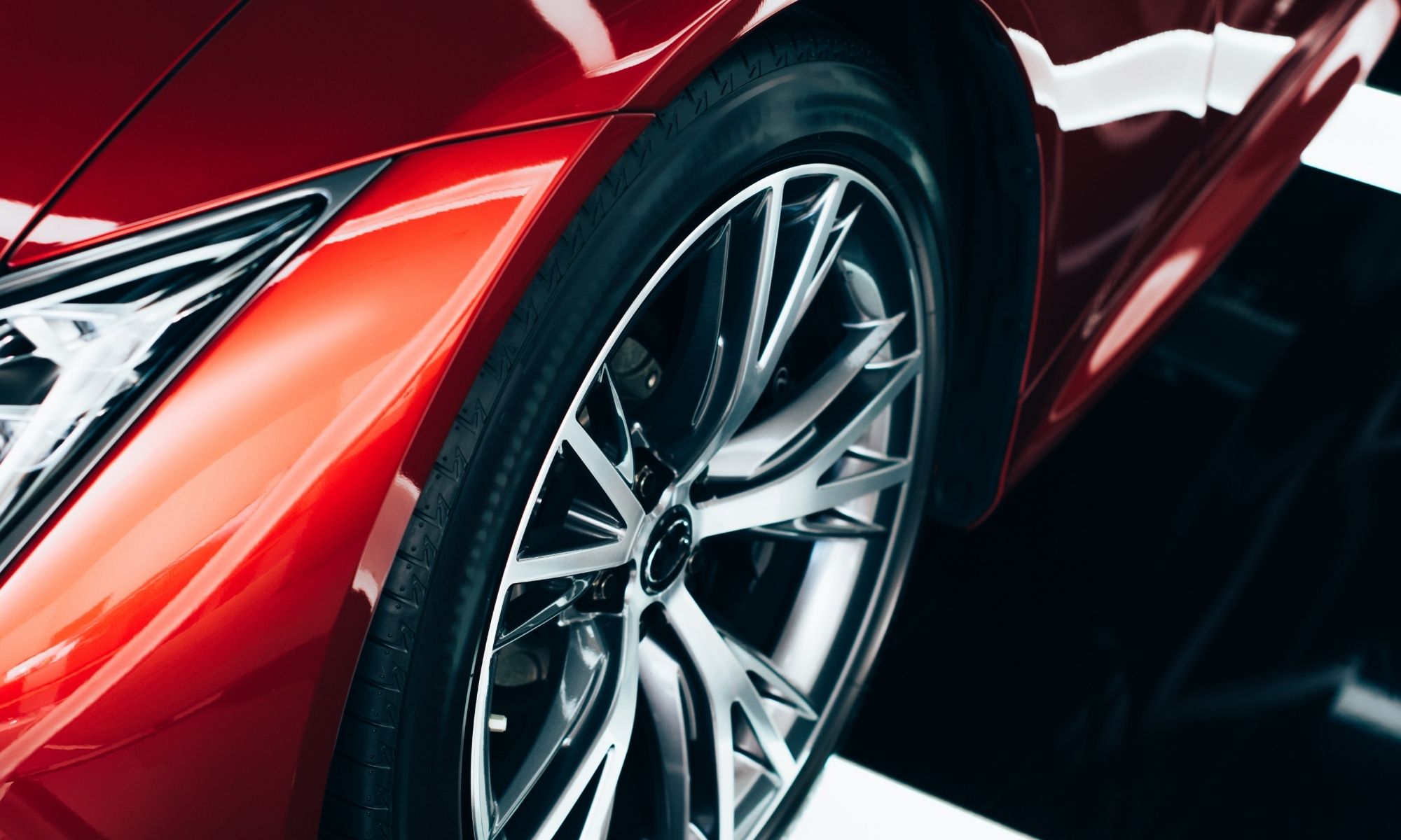 Red car wheel with polished silver alloy rim